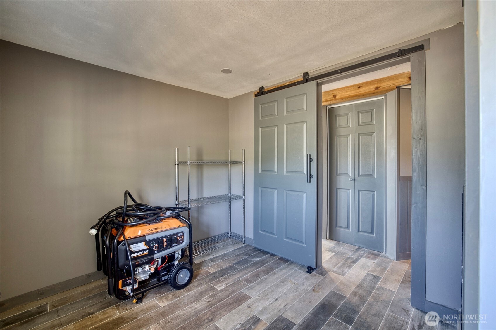 40 Main Street Pacific Beach, WA 98571 - Photo 37 of 40 a view of a room that has a bed and wooden floor