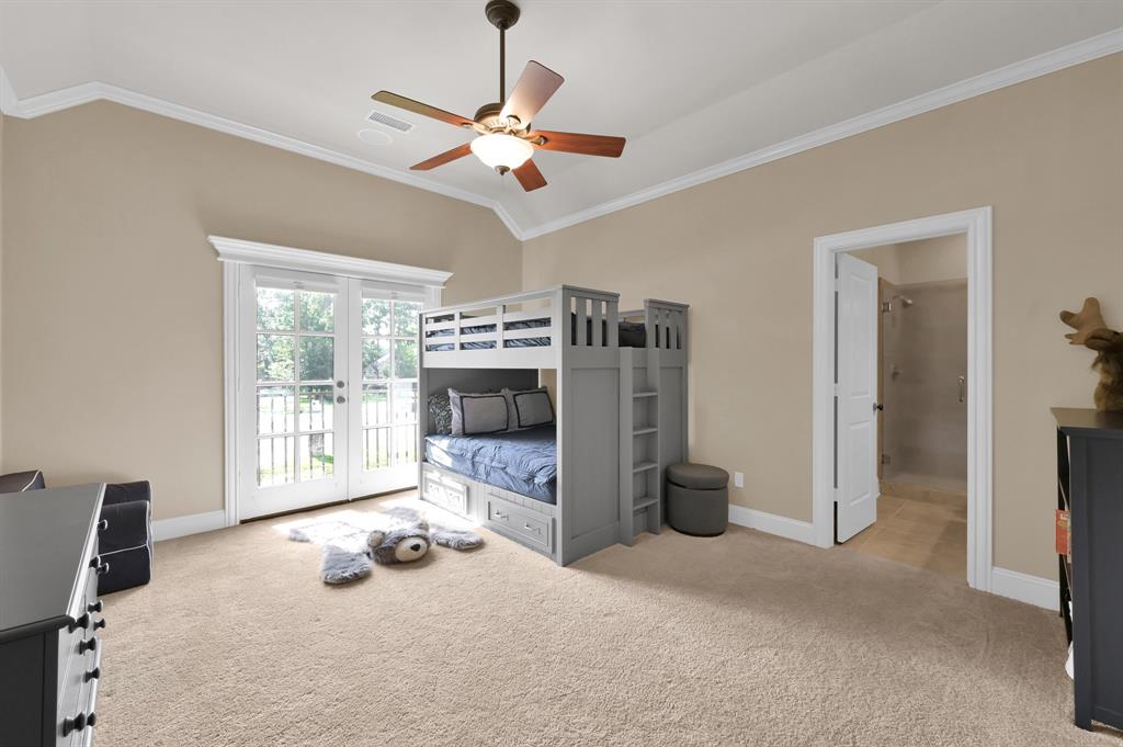 4111 Angling Lane Spring, TX 77386 - Photo 19 of 27 Bedroom with light carpet, crown molding, access to exterior, lofted ceiling, and ceiling fan