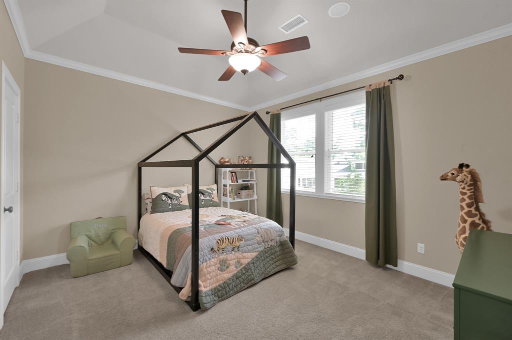 4111 Angling Lane Spring, TX 77386 - Photo 20 of 27 Bedroom with ornamental molding, ceiling fan, and light colored carpet
