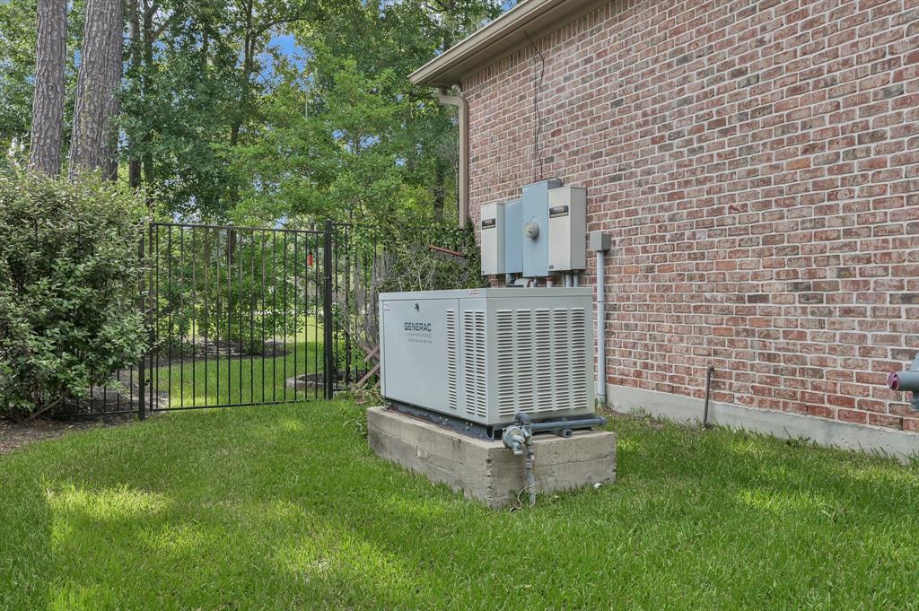 4111 Angling Lane Spring, TX 77386 - Photo 25 of 27 Exterior view of brick siding and a power unit