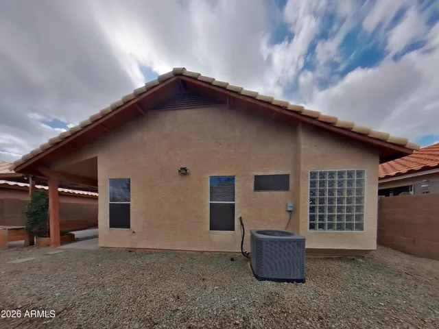 a white toilet sitting next to a bath tub