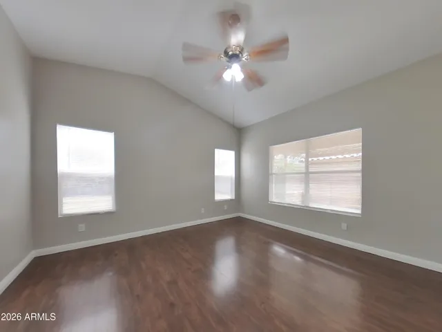 a view of a kitchen with a sink cabinets and wooden floor