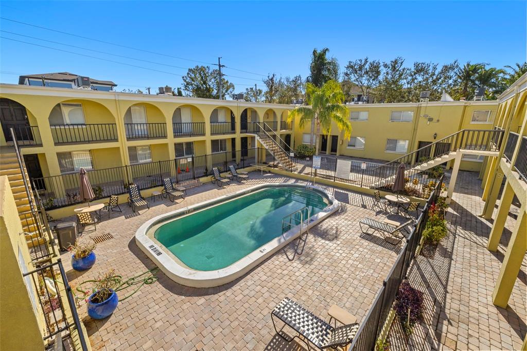 3206 West Azeele Street, Unit 128 Tampa, FL 33609 - Photo 18 of 18 a view of a swimming pool with a patio