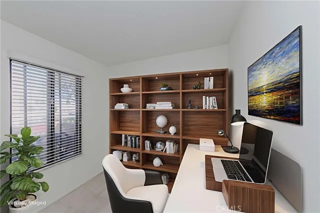 a view of a livingroom with furniture and a flat screen tv