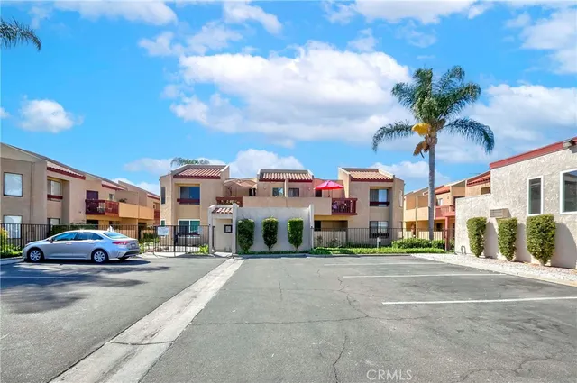 a city street lined with buildings and cars