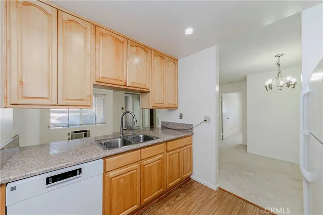 a kitchen with a sink cabinets and window