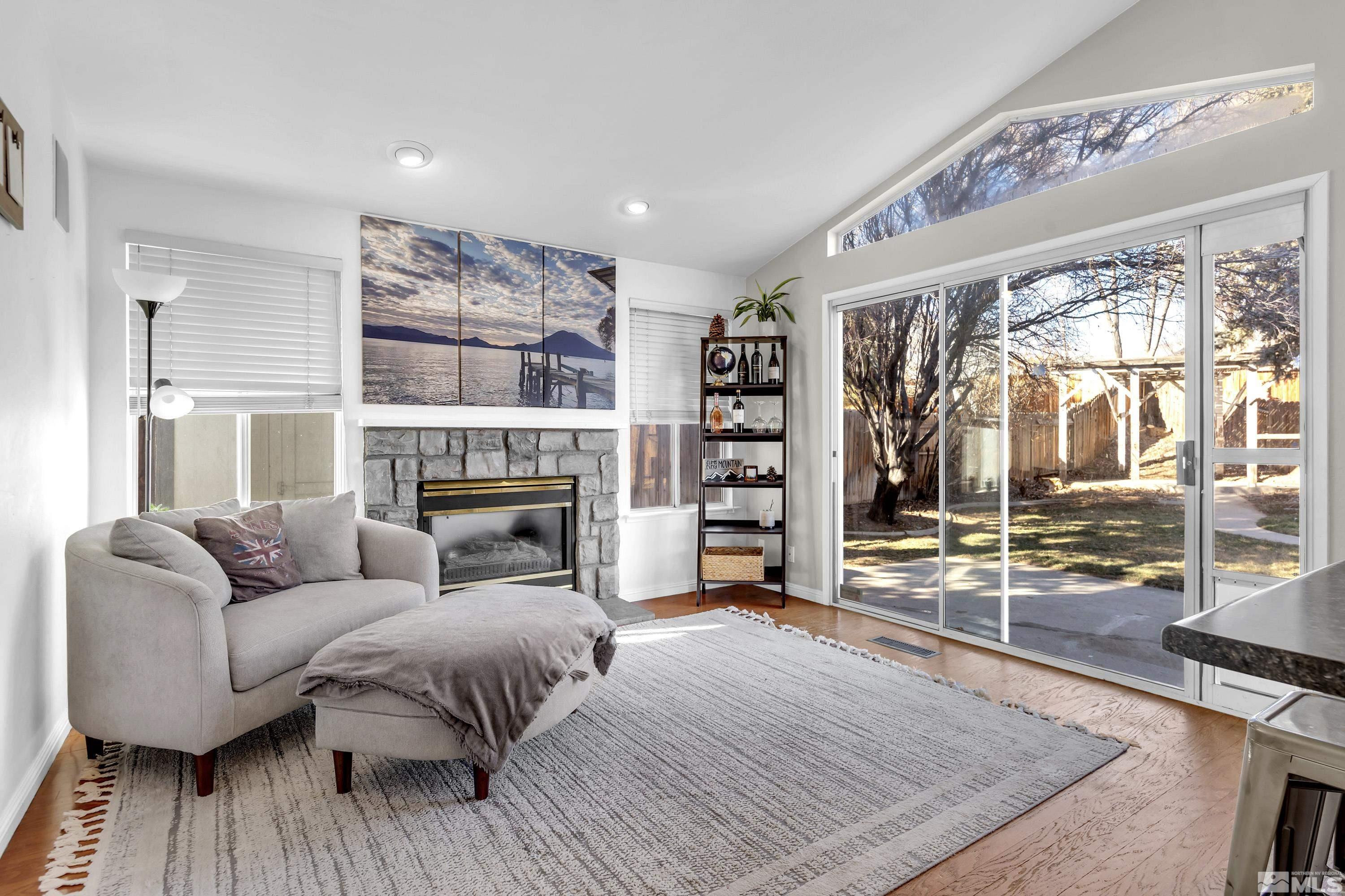 1121 Shadelands Court Reno, NV 89523 - Photo 16 of 38 a living room with furniture and a fireplace