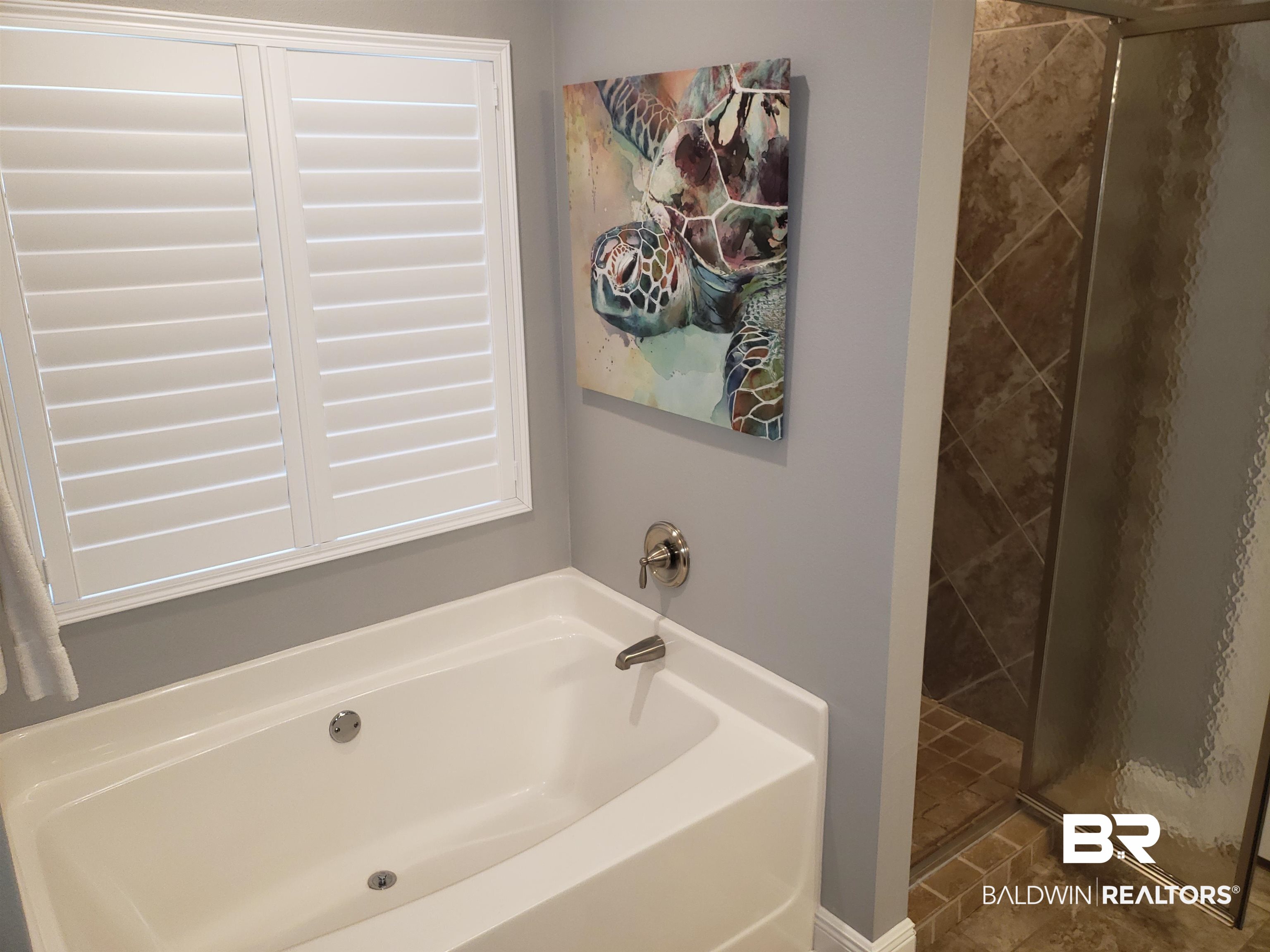 23373 Dundee Circle Foley, AL 36535 - Photo 14 of 34 Bathroom with Garden tub plus walk in tiled shower and tile patterned floors