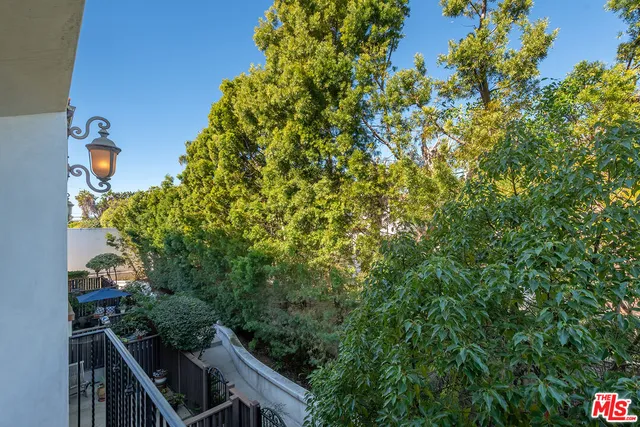 a view of a house with a tree