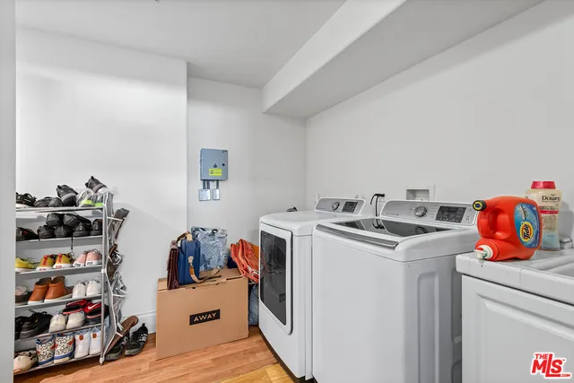 a storage room with washer and dryer washer and dryer