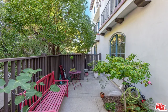 a backyard of a house with outdoor seating