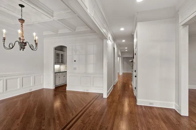 a view of a room with wooden floor and staircase