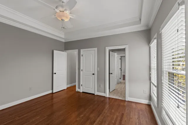 a view of a house with a wooden fence
