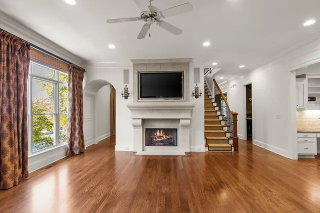 a living room with furniture fireplace and flat screen tv