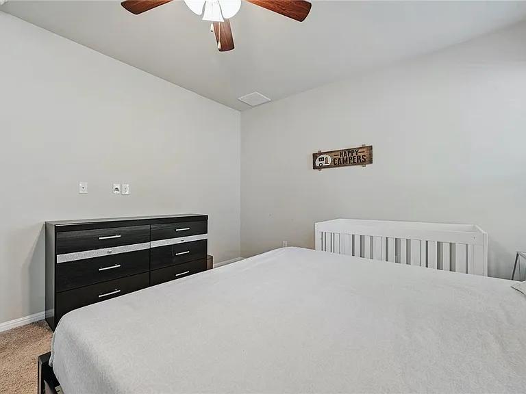 906 Boatswain Way Austin, TX 78748 - Photo 13 of 26 Bedroom with light carpet and a ceiling fan