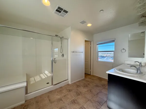 a bathroom with a sink vanity and a mirror