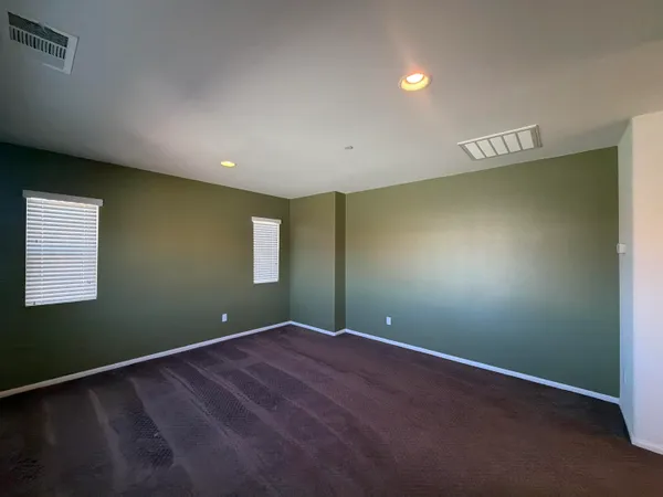 an empty room with an empty space and a window