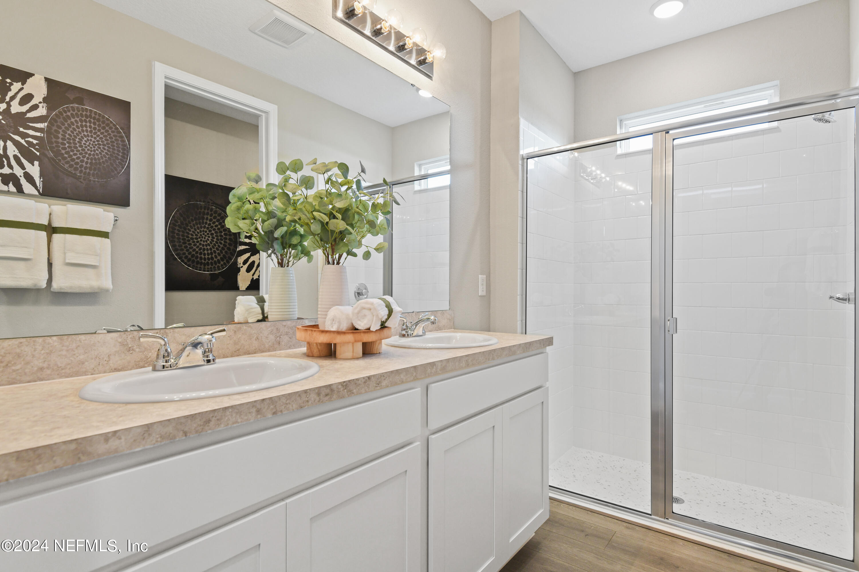 333 Cedar Elm Way St. Augustine, FL 32092 - Photo 12 of 24 a bathroom with a granite countertop sink and a mirror