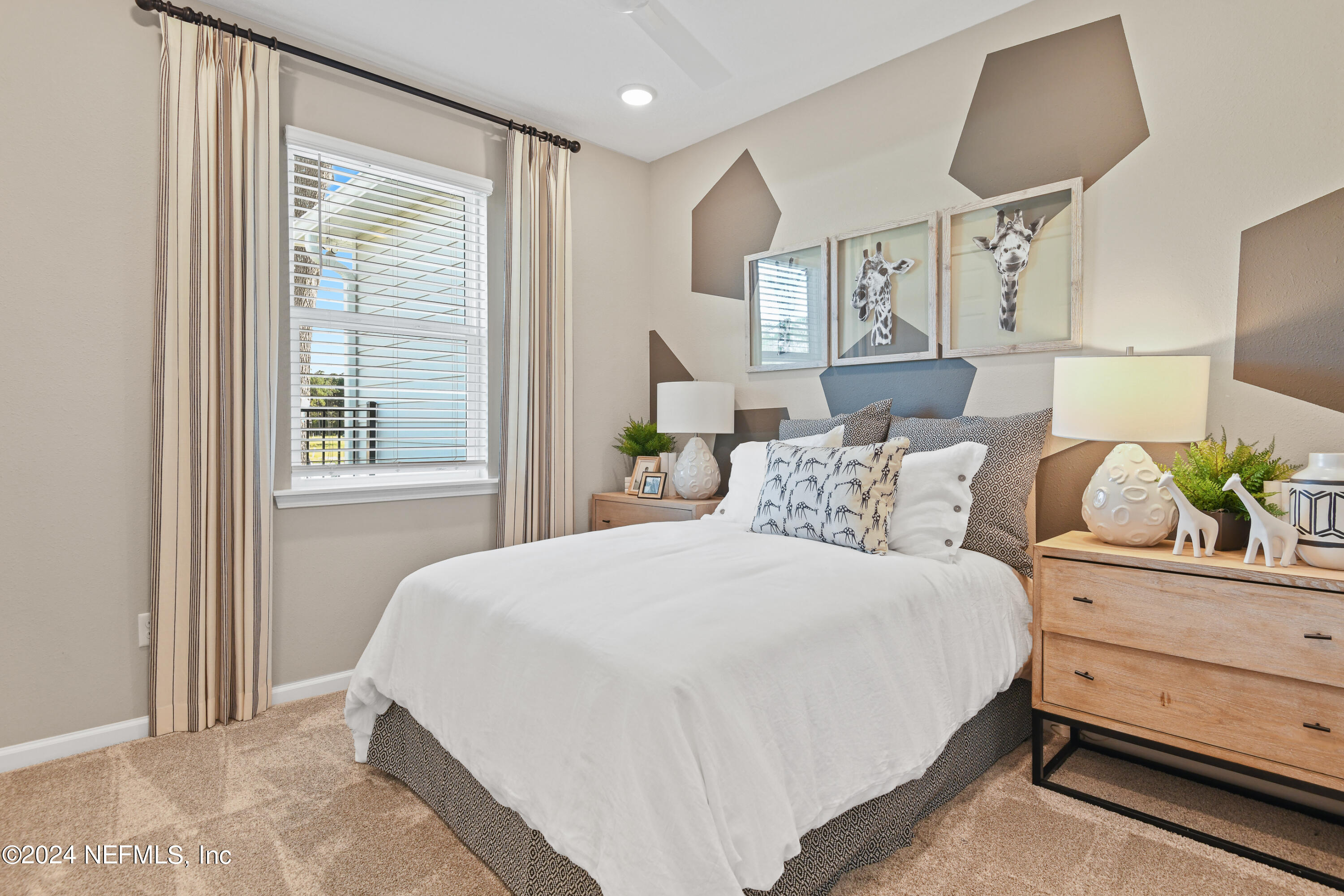 333 Cedar Elm Way St. Augustine, FL 32092 - Photo 14 of 24 a bedroom with a bed and a window