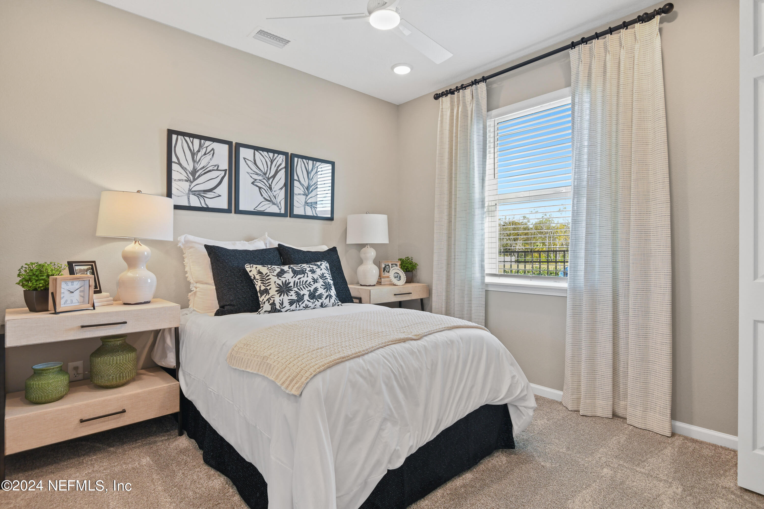 333 Cedar Elm Way St. Augustine, FL 32092 - Photo 16 of 24 a bedroom with a bed and a window
