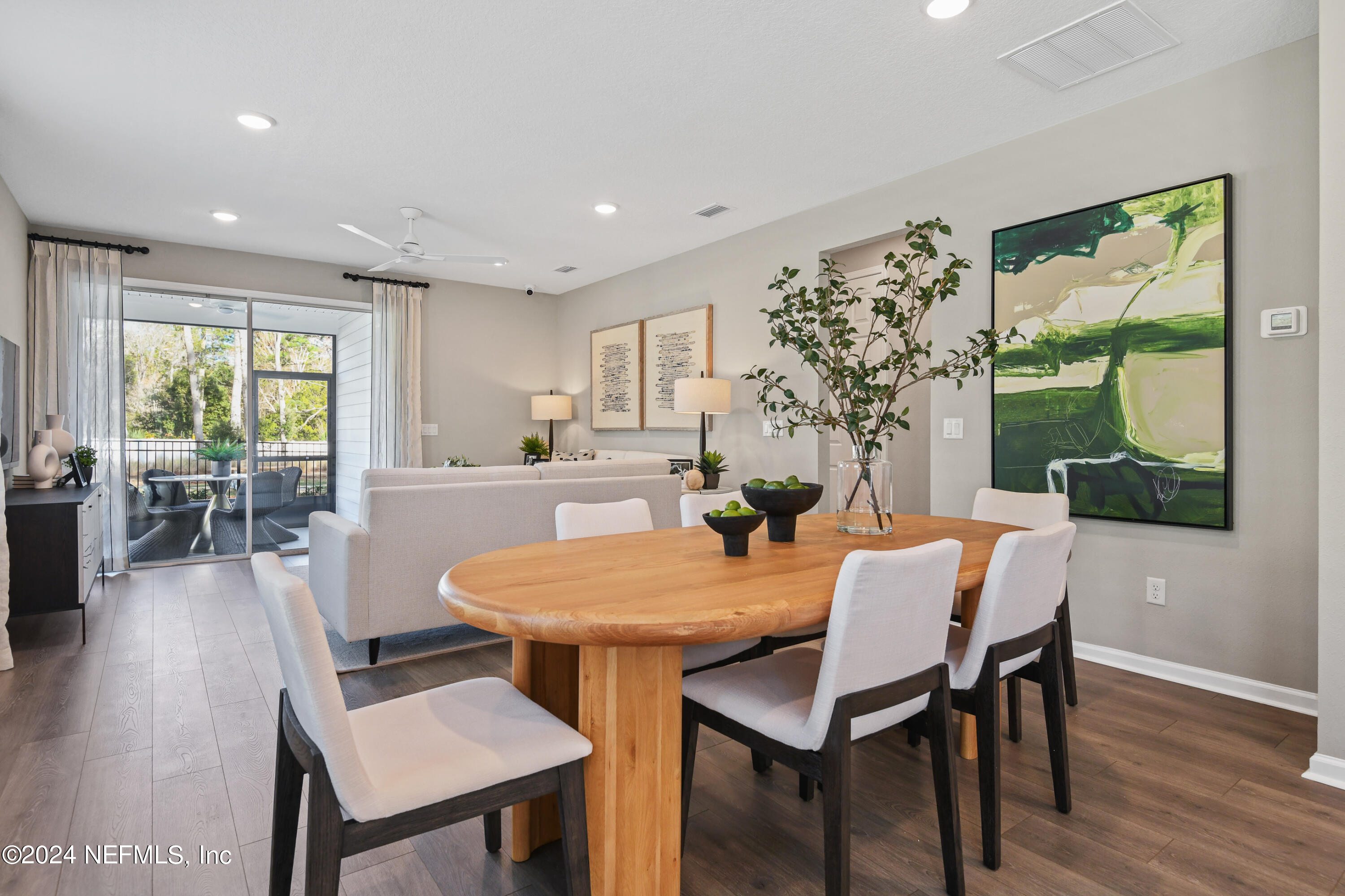 333 Cedar Elm Way St. Augustine, FL 32092 - Photo 8 of 24 a view of a dining room with furniture window and wooden floor