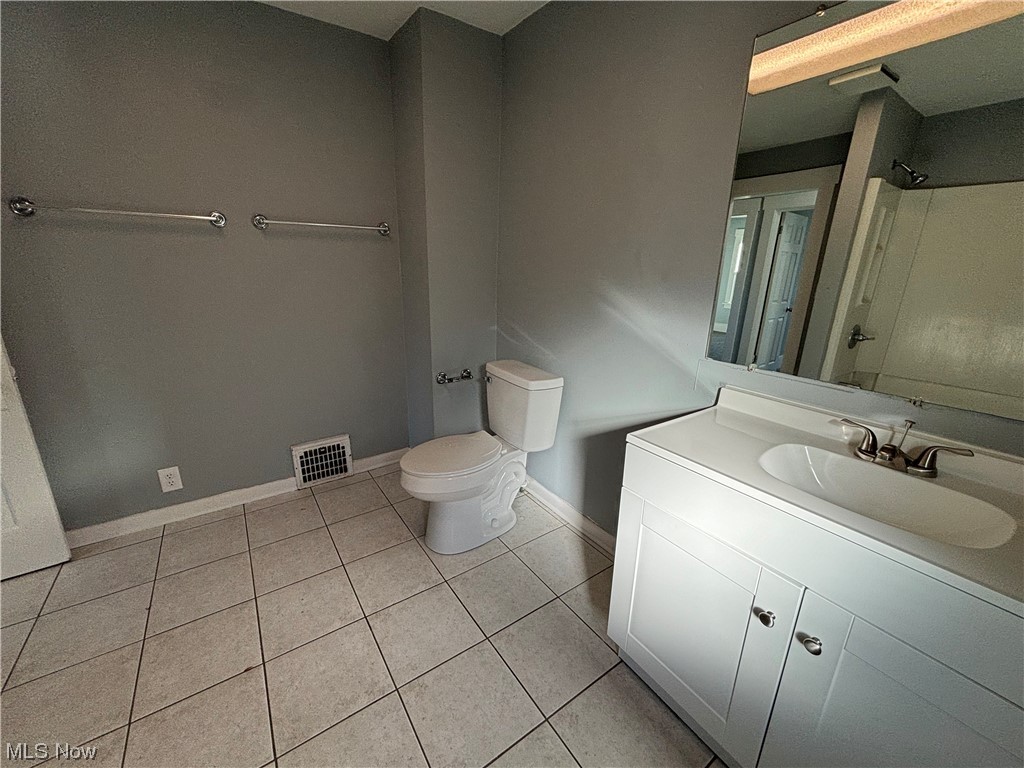 2711 11th Street Northwest Canton, OH 44708 - Photo 7 of 16 Bathroom featuring vanity, tile flooring, and toilet