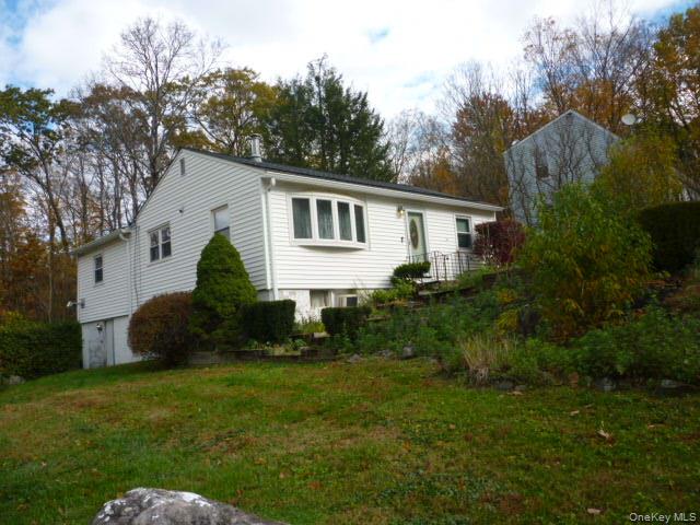 11 Hazel Drive Patterson, NY 12563 - Photo 2 of 20 a front view of house with yard and green space