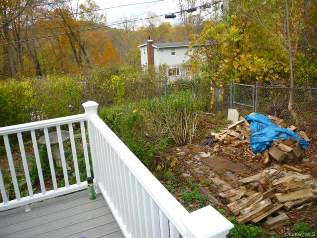 11 Hazel Drive Patterson, NY 12563 - Photo 4 of 20 a balcony with wooden floor and lake view