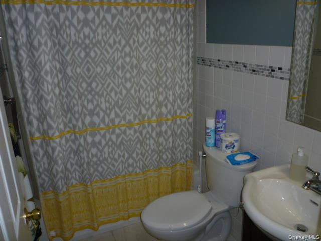 11 Hazel Drive Patterson, NY 12563 - Photo 10 of 20 a white toilet sitting next to a bathroom sink