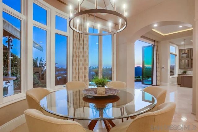 a spacious bedroom with a large bed and a large window