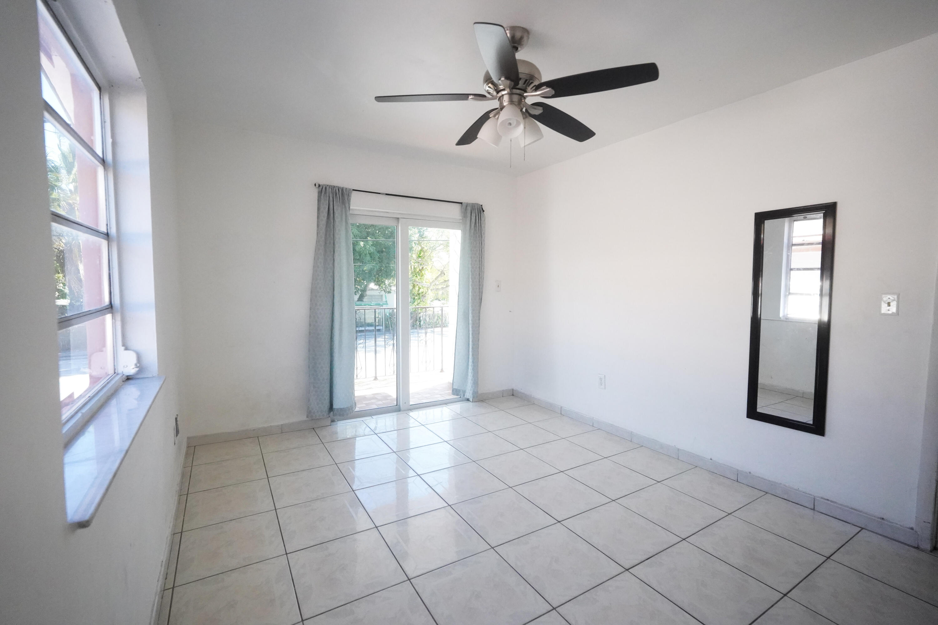 1882 Southwest 17th Avenue Miami, FL 33145 - Photo 13 of 28 a view of an empty room with a window