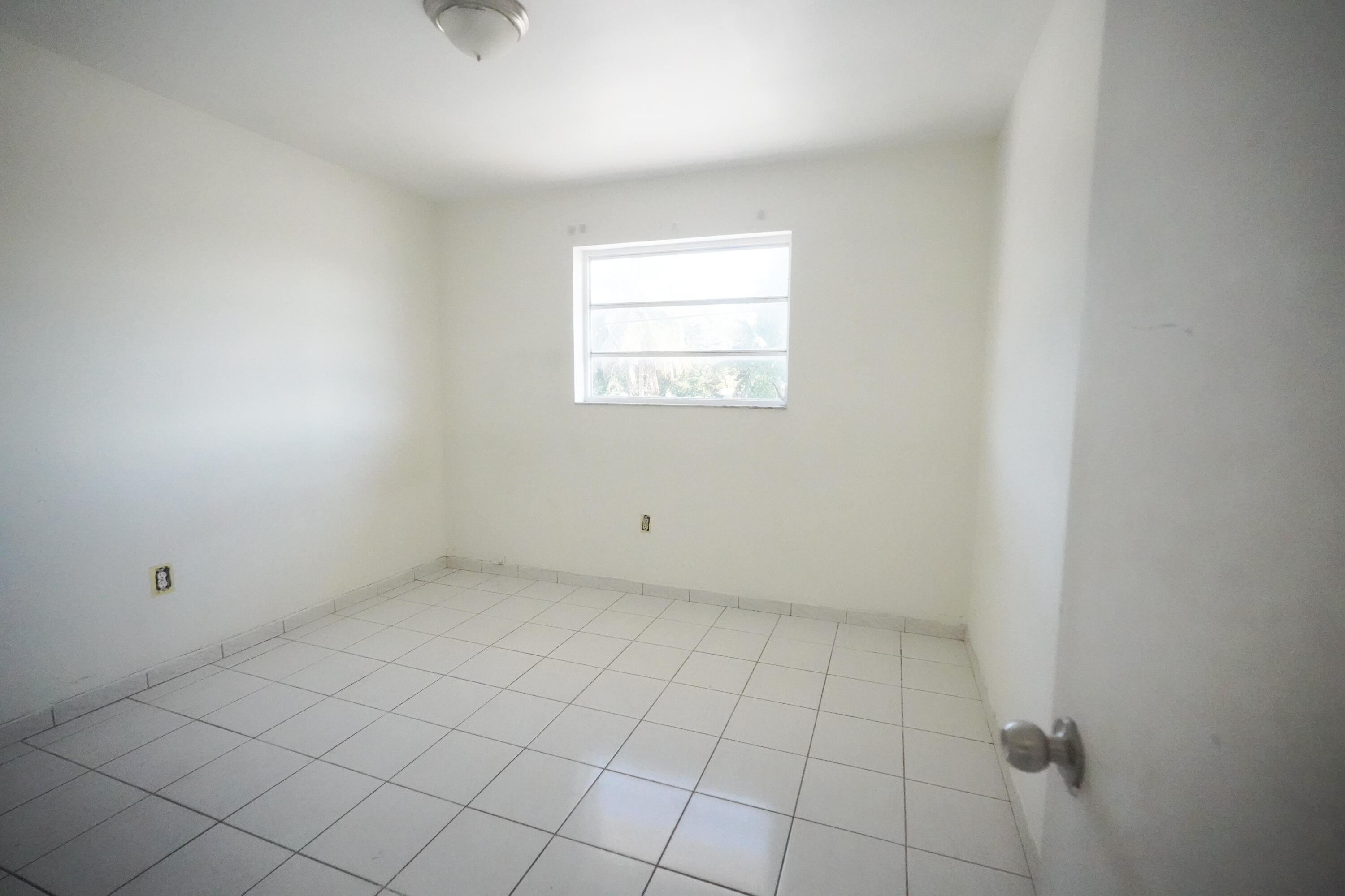 1882 Southwest 17th Avenue Miami, FL 33145 - Photo 15 of 28 a view of an empty room with a window