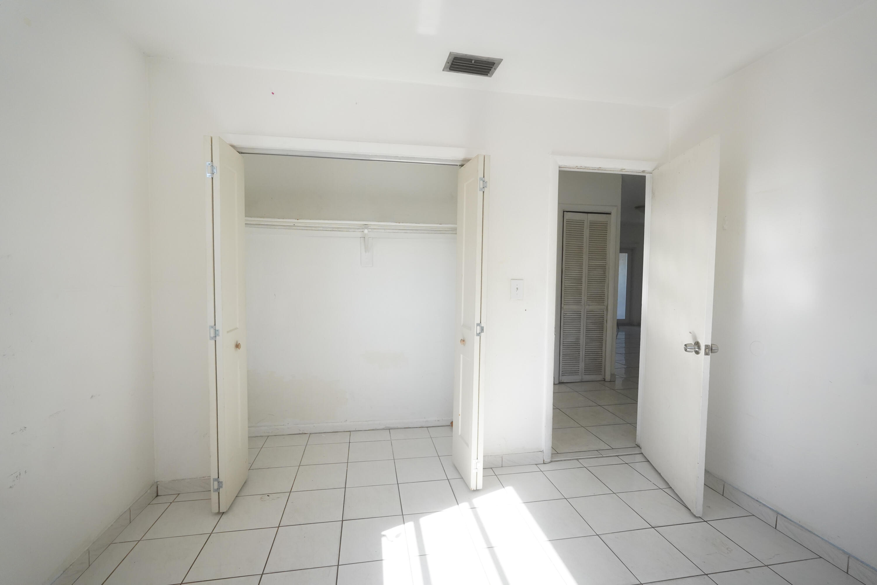 1882 Southwest 17th Avenue Miami, FL 33145 - Photo 18 of 28 a view of an empty room and window