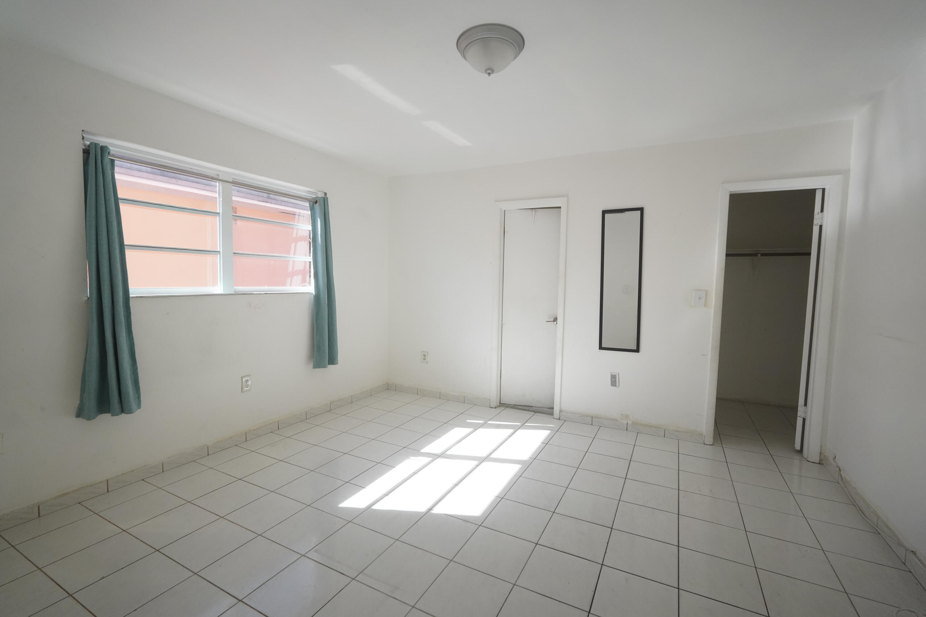 1882 Southwest 17th Avenue Miami, FL 33145 - Photo 20 of 28 a view of an empty room and window