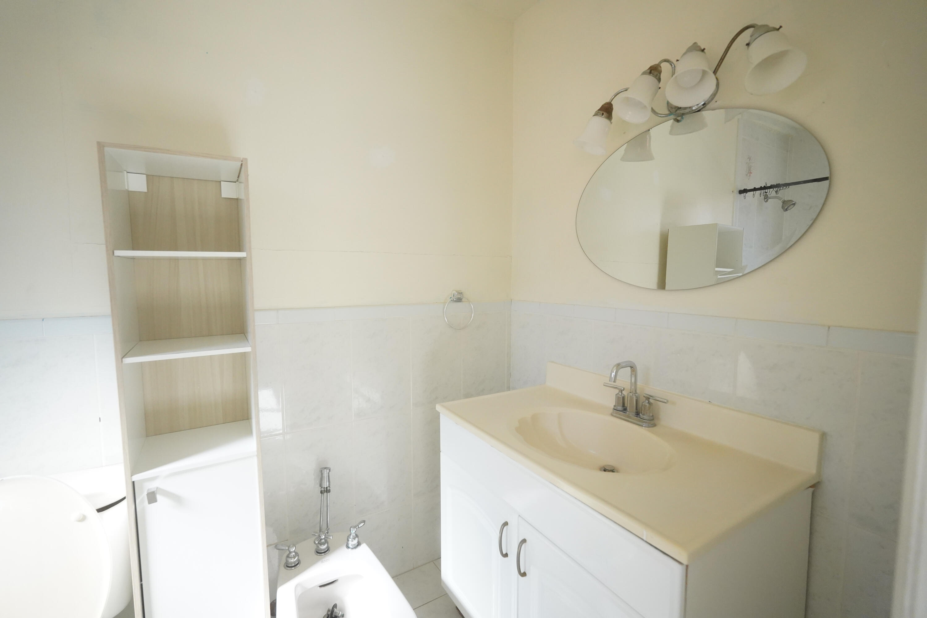 1882 Southwest 17th Avenue Miami, FL 33145 - Photo 22 of 28 a bathroom with a sink a mirror and a shower