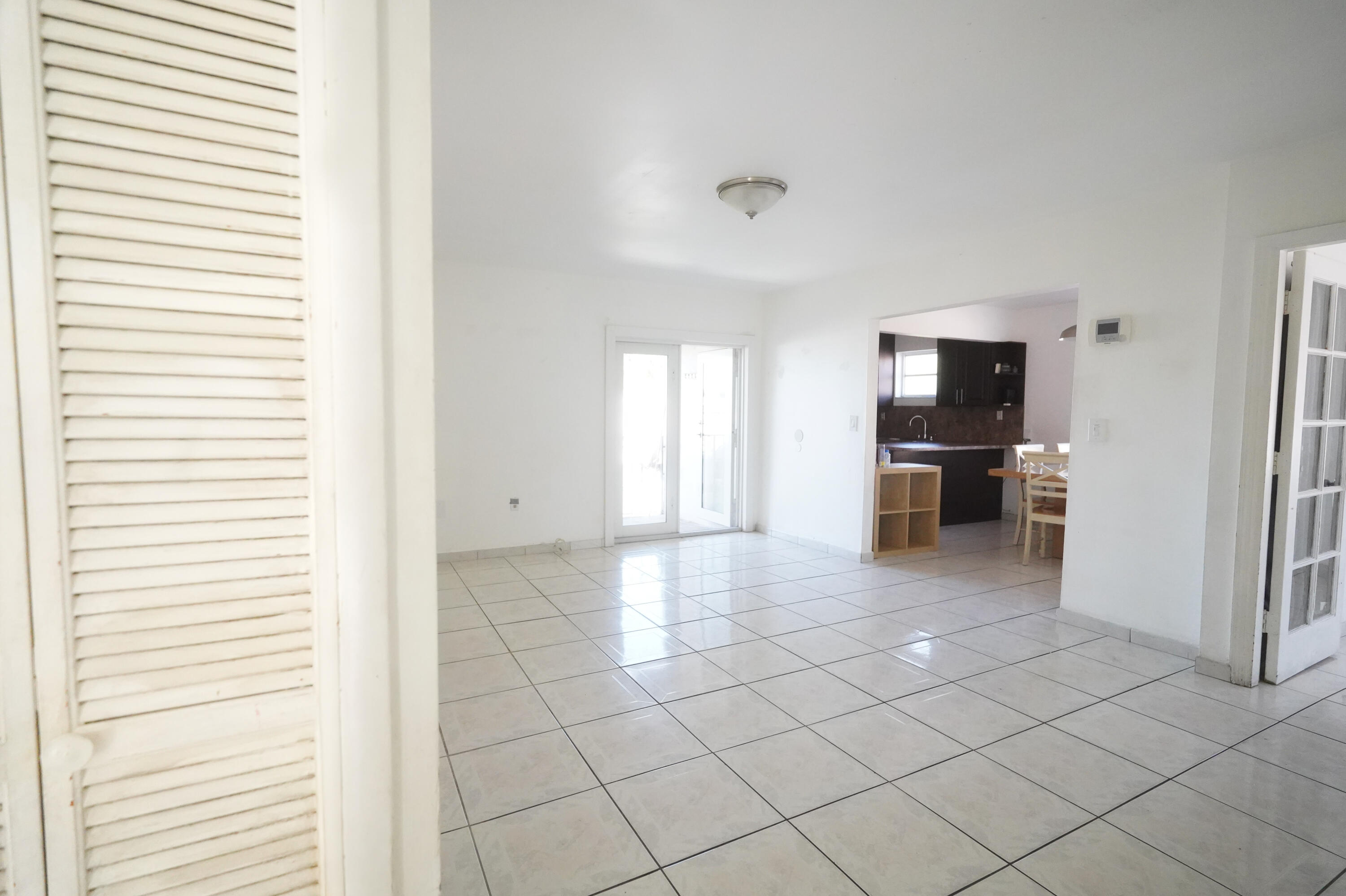 1882 Southwest 17th Avenue Miami, FL 33145 - Photo 6 of 28 a view of empty room with refrigerator and window