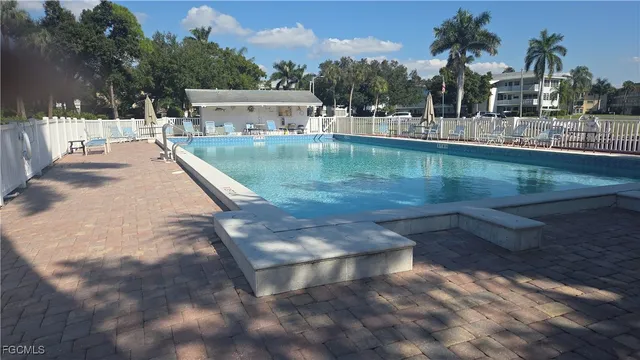 a view of a chairs and table in patio