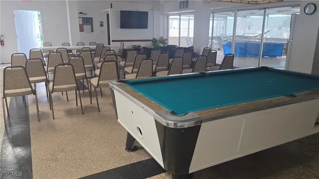 a room with washing machine and cabinets