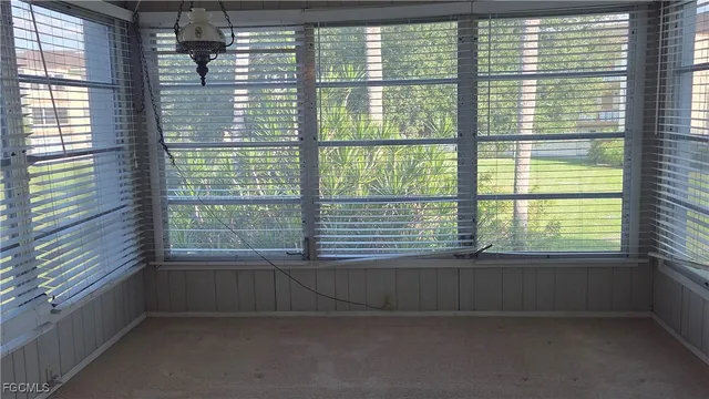 a view of a room that has a window