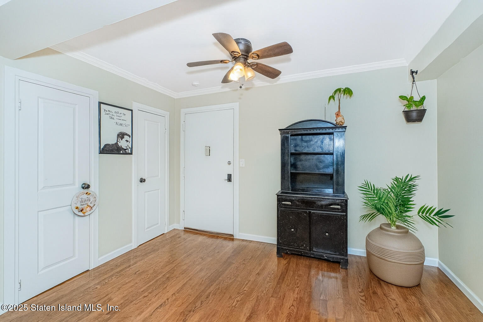 1160 Richmond Road, Unit 6A Staten Island, NY 10304 - Photo 11 of 14 a view of a livingroom with wooden floor and closet