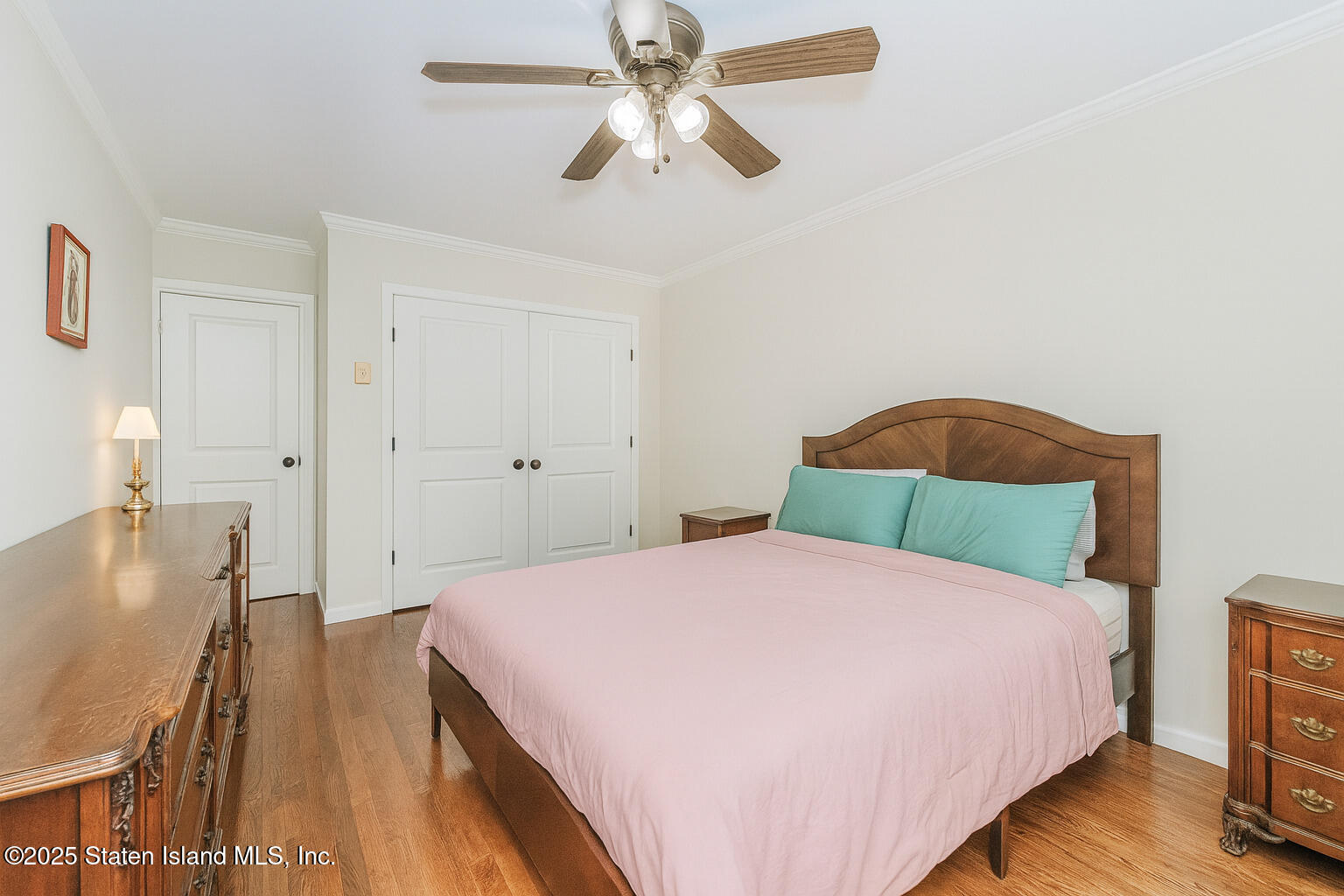 1160 Richmond Road, Unit 6A Staten Island, NY 10304 - Photo 10 of 14 a bedroom with a bed and wooden floor