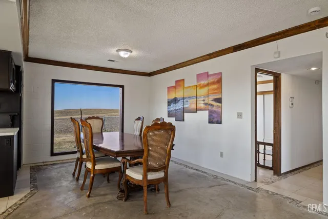 a kitchen with cabinets and window