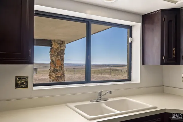 a view of a bathroom with a sink and a window