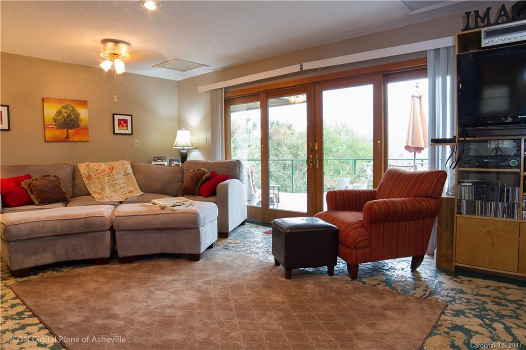 8 Elmers Place Fairview, NC 28730 - Photo 15 of 21 a living room with furniture and a flat screen tv