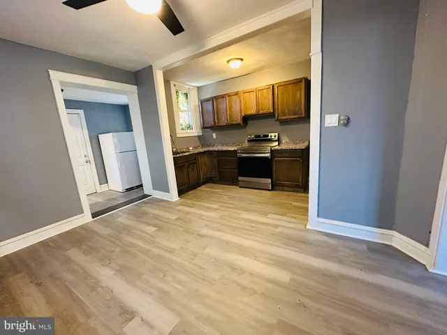 a large bathroom with a sink and a mirror
