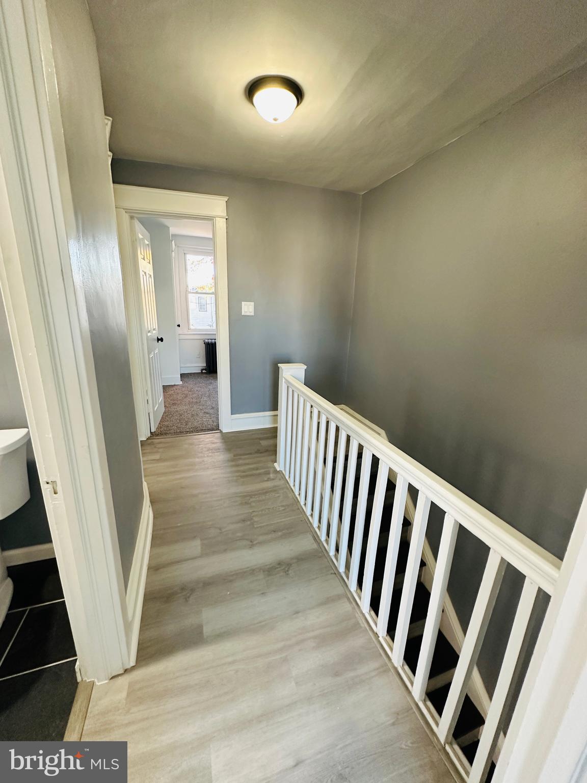 149 Wayne Avenue Collingdale, PA 19023 - Photo 24 of 28 a view of a hallway with wooden floor and staircase