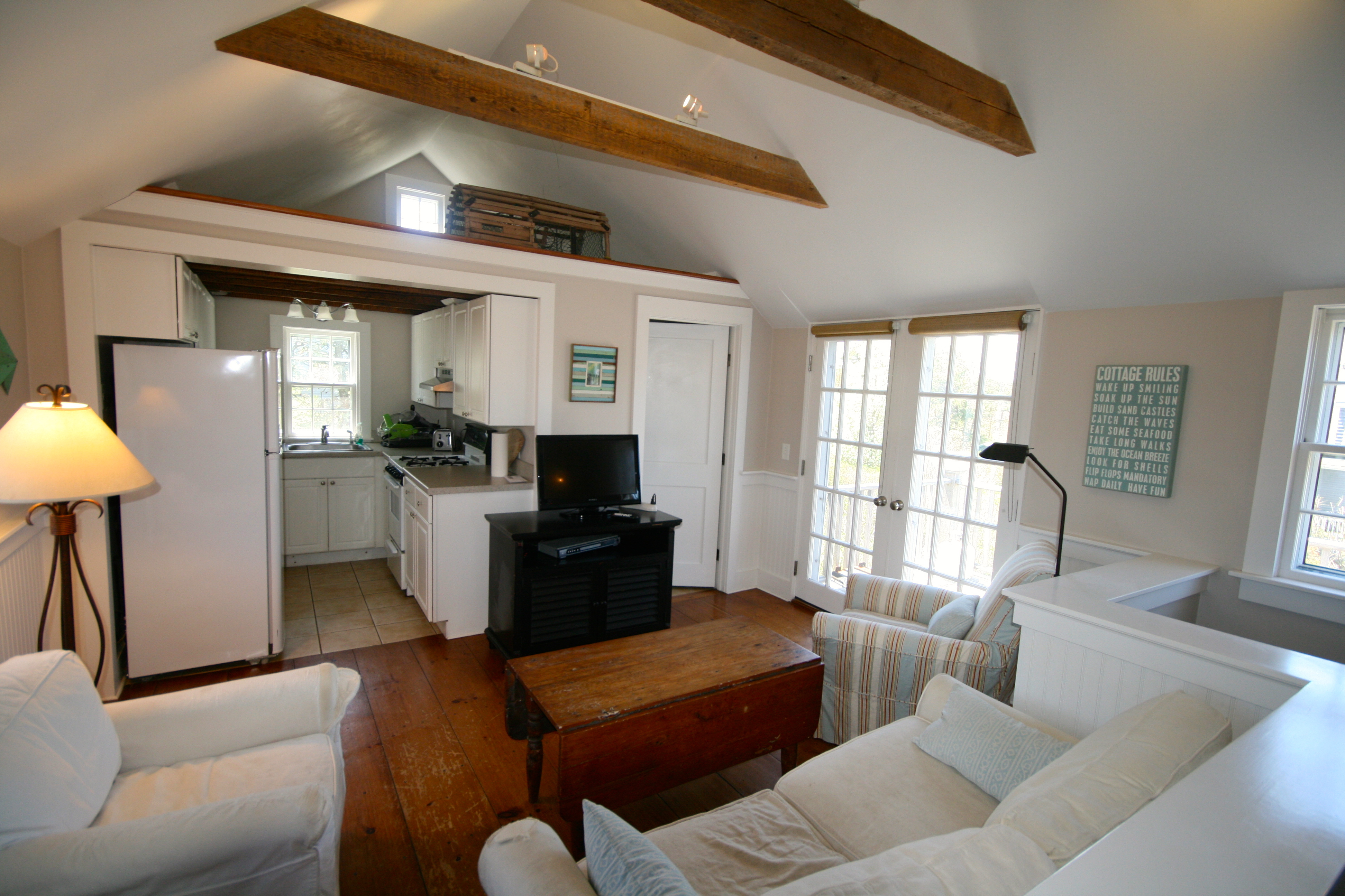 29 South A S Shore Road, Unit A Nantucket, MA 02554 - Photo 9 of 19 a living room with furniture and a large window