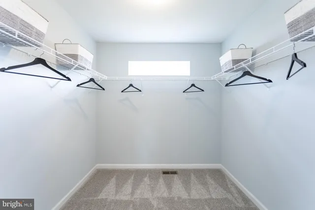 a view of a room with racks on the wall