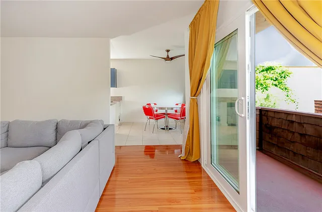 a living room with a couch and a window