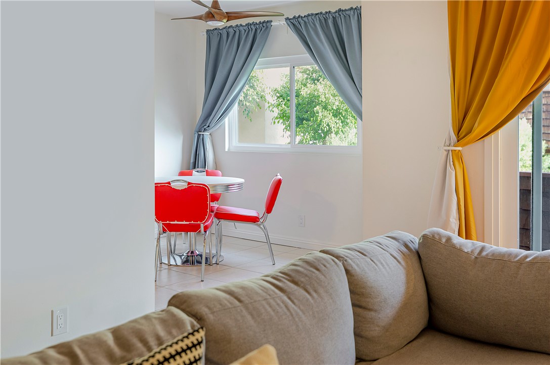 5400 Newcastle Avenue, Unit 70 Encino, CA 91316 - Photo 15 of 32 a living room with a couch and a window